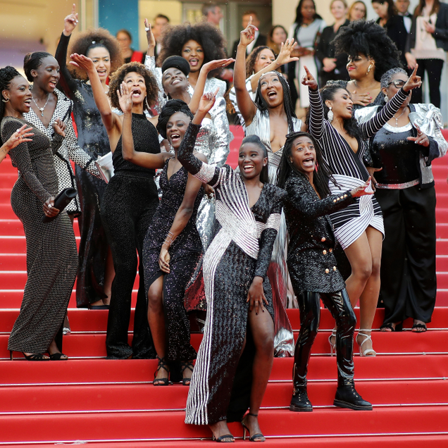 Co-authors of the book Noire N’est Pas Mon Metier (Black Is Not My Job) pose on the stairs of the Palais des Festivals convention center during the Cannes Film Festival on May 16, 2018, in Cannes, France.